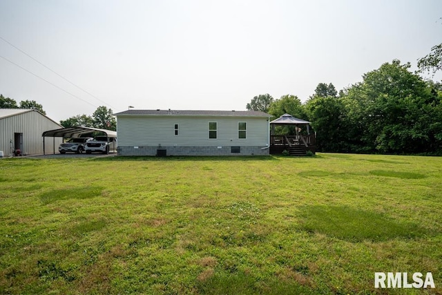 11271 W Center Rd, Mulkeytown, IL 62865 - rear view of property with a gazebo, a yard, a carport, and crawl space