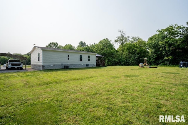 11271 W Center Rd, Mulkeytown, IL 62865 - view of grassy yard with a detached carport