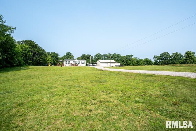 11271 W Center Rd, Mulkeytown, IL 62865 - view of grassy yard featuring a garage