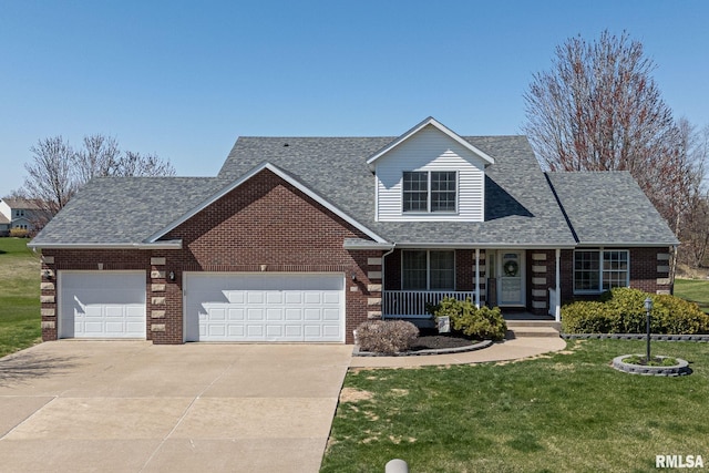 12 Douglas Way, Eldridge, IA 52748 - traditional-style house featuring a garage, brick siding, concrete driveway, and a front yard