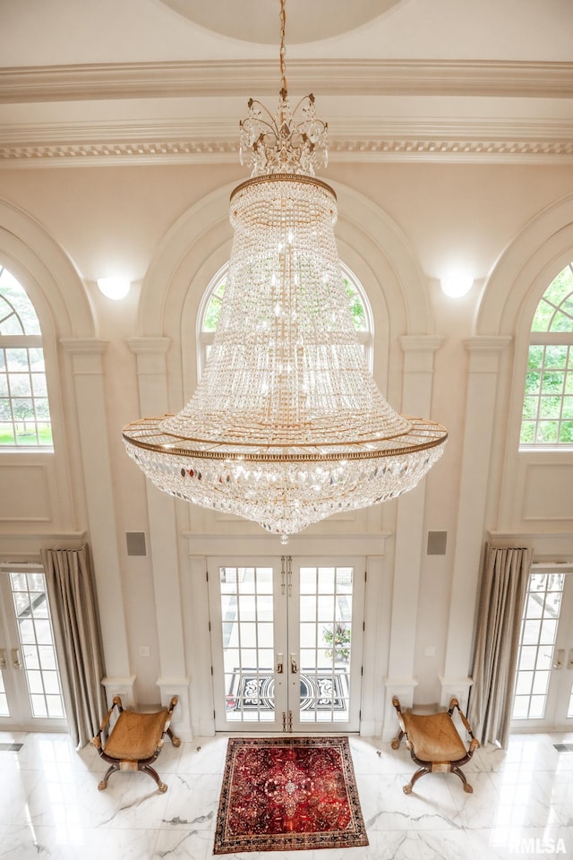 2 Hickory Ct, Rock Island, IL 61201 - entryway with light marble finish floors, a high ceiling, a chandelier, french doors, and ornamental molding