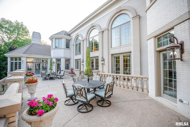 2 Hickory Ct, Rock Island, IL 61201 - view of patio / terrace featuring outdoor dining space and french doors