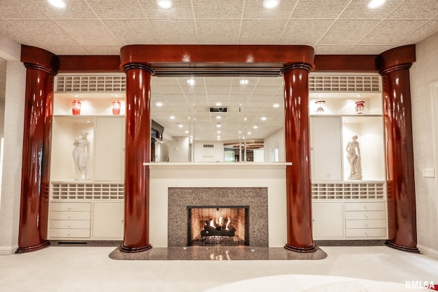 2 Hickory Ct, Rock Island, IL 61201 - unfurnished living room with a lit fireplace, recessed lighting, and decorative columns