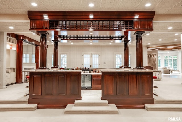 2 Hickory Ct, Rock Island, IL 61201 - bar area featuring beverage cooler, decorative columns, recessed lighting, and a paneled ceiling
