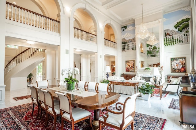 2 Hickory Ct, Rock Island, IL 61201 - dining space featuring a high ceiling, crown molding, and ornate columns
