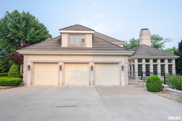 2 Hickory Ct, Rock Island, IL 61201 - view of front of property with driveway, a tiled roof, and a garage