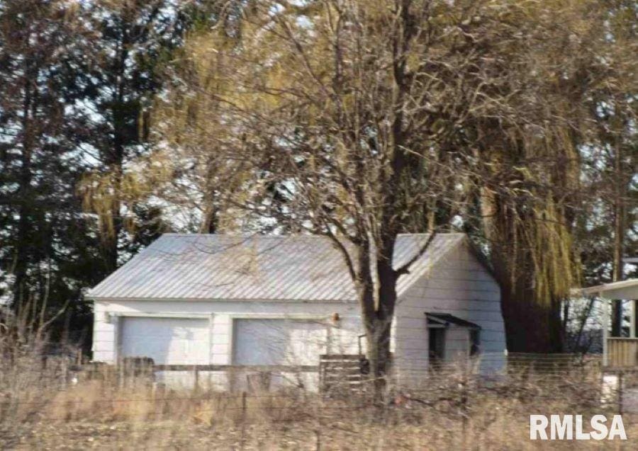 1835 Slater Ave, Winthrop, IA 50682 - view of home's exterior with a garage and metal roof