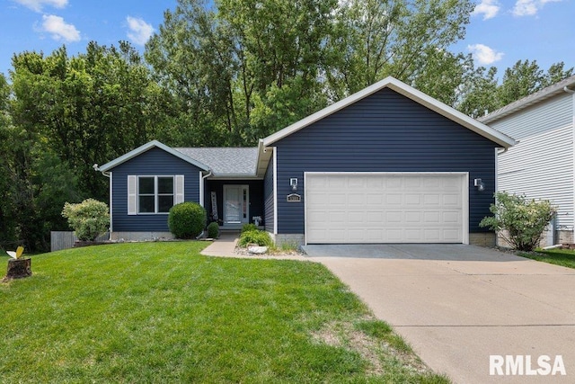 5300 Hillandale Rd, Davenport, IA 52806 - view of front of home with a front lawn, driveway, and an attached garage