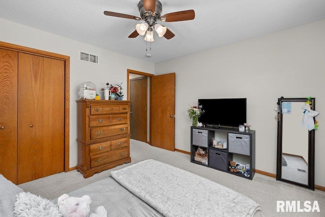 5300 Hillandale Rd, Davenport, IA 52806 - bedroom featuring light colored carpet, a closet, ceiling fan, and a textured ceiling