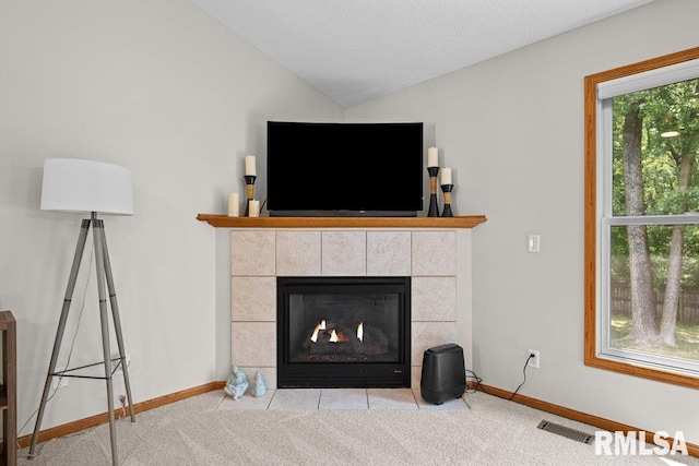 5300 Hillandale Rd, Davenport, IA 52806 - living room with a fireplace, vaulted ceiling, and carpet flooring