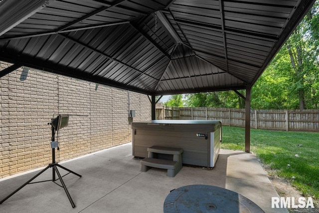 5300 Hillandale Rd, Davenport, IA 52806 - fenced backyard with a hot tub, a gazebo, and a patio