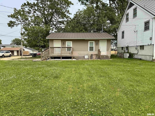 532 8th Ave S, Clinton, IA 52732 - back of house with a yard, entry steps, and metal roof