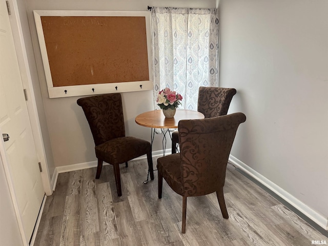 532 8th Ave S, Clinton, IA 52732 - dining space featuring wood finished floors and baseboards