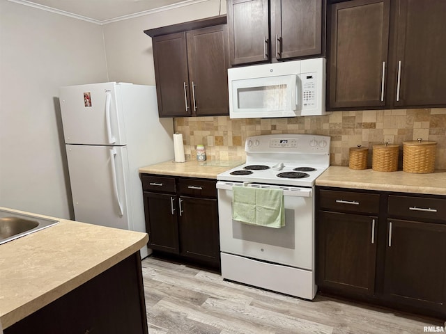 532 8th Ave S, Clinton, IA 52732 - kitchen featuring white appliances, ornamental molding, backsplash, dark brown cabinetry, and light wood finished floors