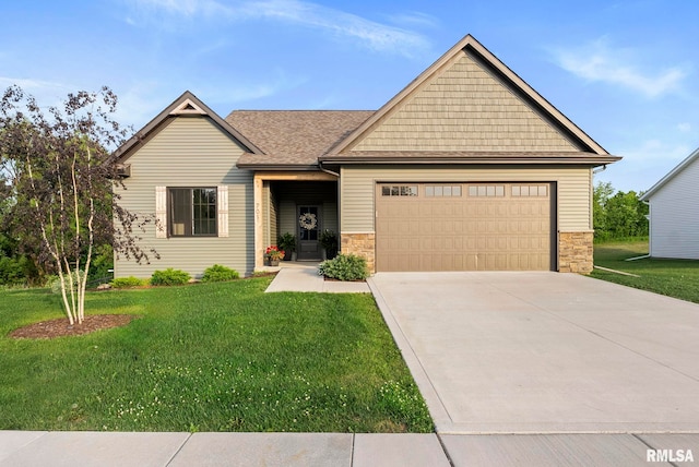 701 Sweet Wood Ln, Blue Grass, IA 52726 - craftsman inspired home with an attached garage, a front yard, concrete driveway, and stone siding