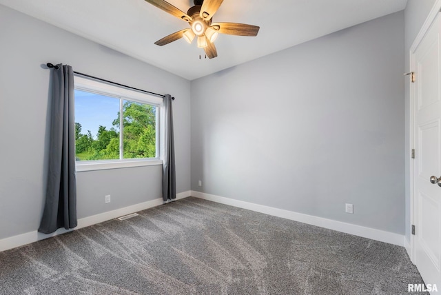 701 Sweet Wood Ln, Blue Grass, IA 52726 - unfurnished room with a ceiling fan and carpet floors