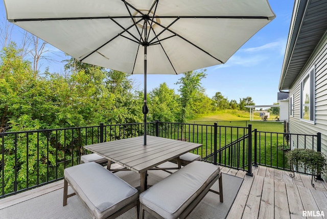 701 Sweet Wood Ln, Blue Grass, IA 52726 - wooden terrace with a yard and outdoor dining space