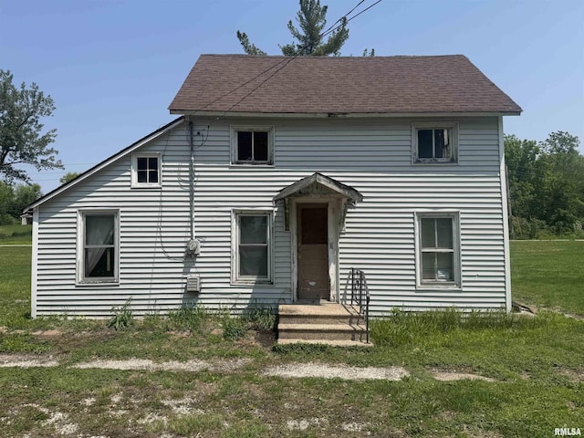 619 Green River St, Colona, IL 61241 - view of front of house featuring a front lawn and roof with shingles