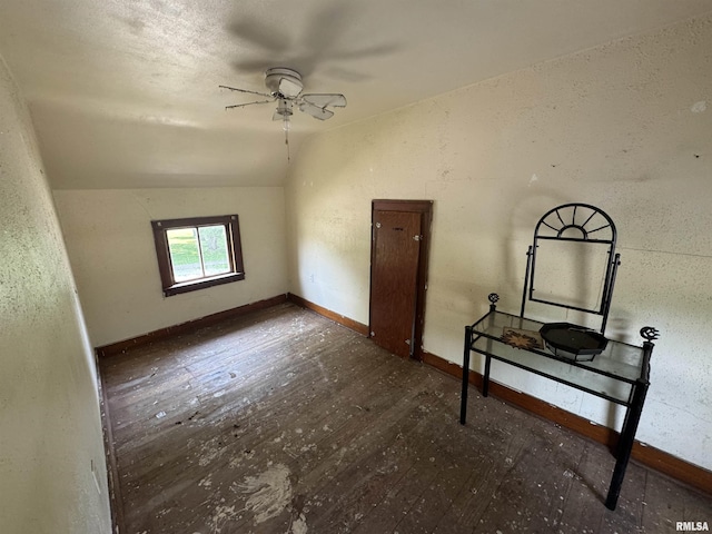 619 Green River St, Colona, IL 61241 - additional living space with ceiling fan, wood-type flooring, vaulted ceiling, and baseboards