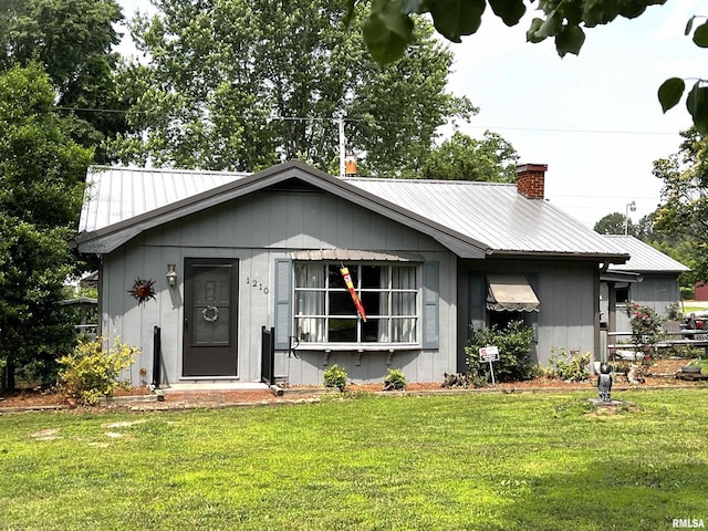 1210 Peterson Ave, Johnston City, IL 62951 - ranch-style house featuring a front lawn and metal roof