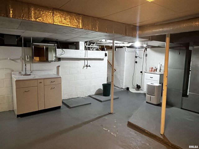 1210 Peterson Ave, Johnston City, IL 62951 - unfinished basement featuring a sink