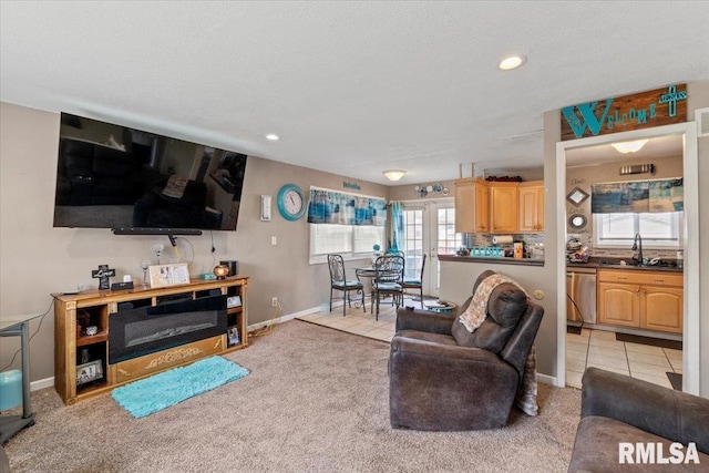 3110 N Pine St, Davenport, IA 52806 - living room featuring baseboards, light carpet, recessed lighting, and light tile patterned floors