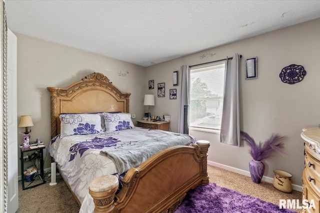 3110 N Pine St, Davenport, IA 52806 - carpeted bedroom with a textured ceiling and baseboards