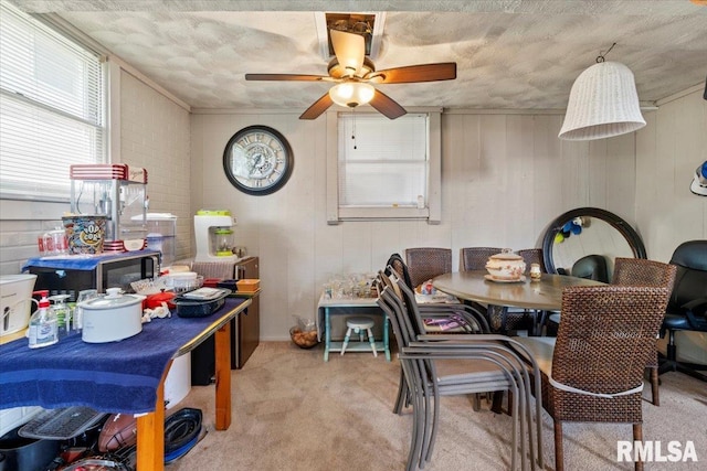 3110 N Pine St, Davenport, IA 52806 - carpeted dining space featuring a ceiling fan