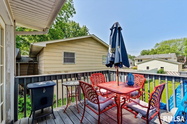 3110 N Pine St, Davenport, IA 52806 - wooden deck featuring outdoor dining space
