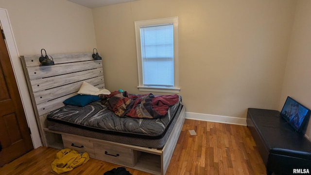 1522 Brady St, Davenport, IA 52803 - bedroom with wood finished floors and baseboards