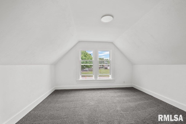2025 W 3rd St, Davenport, IA 52802 - bonus room featuring carpet flooring, baseboards, and vaulted ceiling
