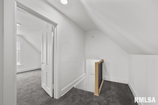 2025 W 3rd St, Davenport, IA 52802 - bonus room with vaulted ceiling, carpet, and baseboards