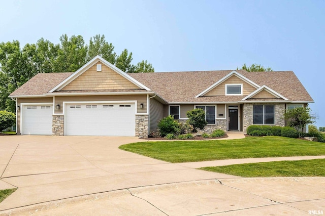 7 Redstone Ct, Le Claire, IA 52753 - craftsman-style home with stone siding, a garage, a front lawn, driveway, and a shingled roof
