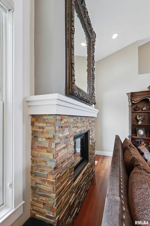 7 Redstone Ct, Le Claire, IA 52753 - living area with hardwood / wood-style floors, recessed lighting, a fireplace, and baseboards