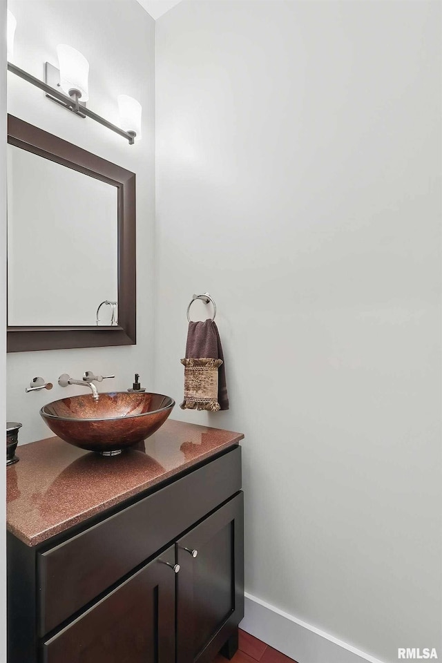 7 Redstone Ct, Le Claire, IA 52753 - bathroom featuring vanity and baseboards