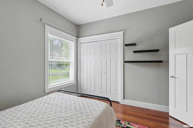 7 Redstone Ct, Le Claire, IA 52753 - bedroom featuring wood finished floors, baseboards, ceiling fan, and a closet