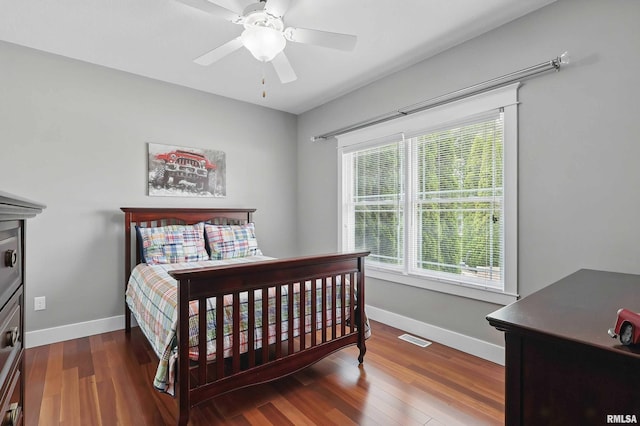 7 Redstone Ct, Le Claire, IA 52753 - bedroom with baseboards, wood finished floors, and a ceiling fan