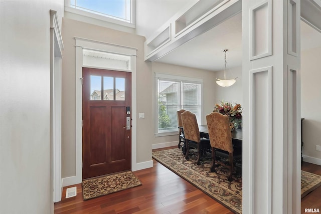 7 Redstone Ct, Le Claire, IA 52753 - entrance foyer with dark wood-type flooring and baseboards
