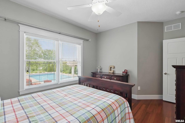 7 Redstone Ct, Le Claire, IA 52753 - bedroom with multiple windows, dark wood finished floors, baseboards, and a ceiling fan