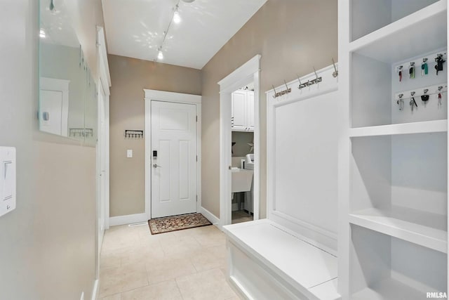 7 Redstone Ct, Le Claire, IA 52753 - mudroom with rail lighting, baseboards, and light tile patterned floors