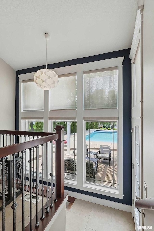 7 Redstone Ct, Le Claire, IA 52753 - doorway to outside featuring tile patterned floors
