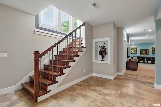 7 Redstone Ct, Le Claire, IA 52753 - stairs with baseboards and recessed lighting