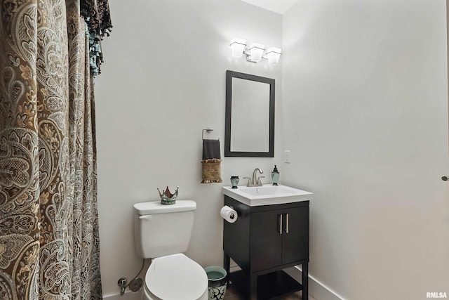 7 Redstone Ct, Le Claire, IA 52753 - full bathroom with vanity, toilet, and baseboards