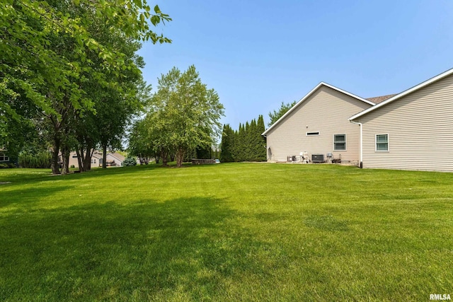 7 Redstone Ct, Le Claire, IA 52753 - view of grassy yard featuring cooling unit