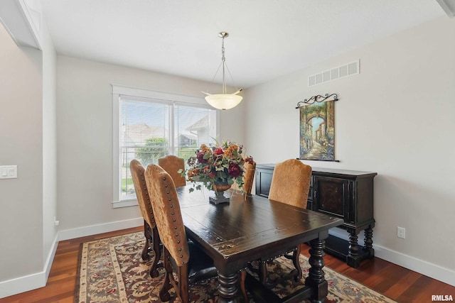 7 Redstone Ct, Le Claire, IA 52753 - dining room featuring baseboards and dark wood-type flooring