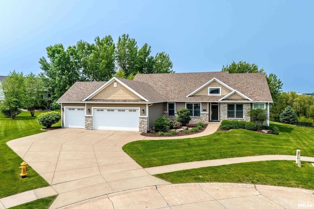 7 Redstone Ct, Le Claire, IA 52753 - craftsman-style home featuring stone siding, a front lawn, concrete driveway, and an attached garage