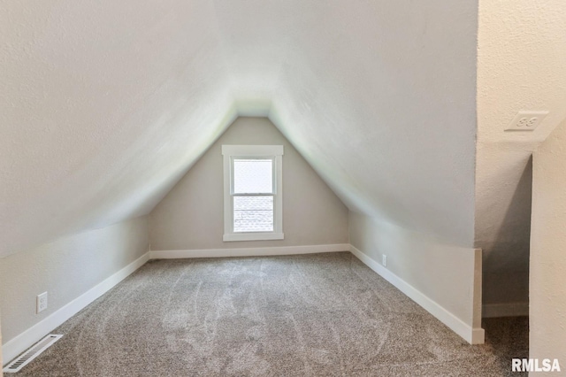 2320 E High St, Davenport, IA 52803 - bonus room featuring carpet floors, vaulted ceiling, and baseboards