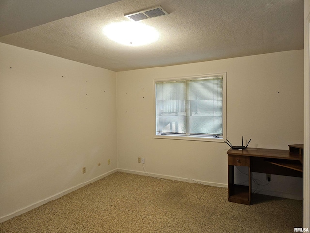 2120 Fareway Dr, Muscatine, IA 52761 - unfurnished office with carpet, baseboards, and a textured ceiling