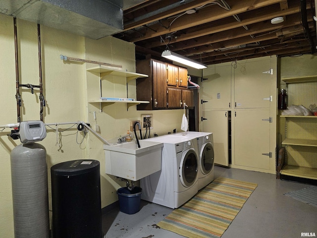 2120 Fareway Dr, Muscatine, IA 52761 - laundry area featuring washer and clothes dryer and cabinet space