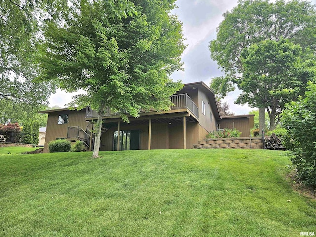 2120 Fareway Dr, Muscatine, IA 52761 - back of house featuring a deck, a yard, and stairs